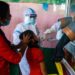 A health official collects nasal and throat swab samples from a girl to test for the Covid-19 coronavirus at a primary health centre  in Siliguri on September 2, 2020. - India on August 30 set a coronavirus record when it reported 78,761 new infections in 24 hours the world's highest single day rise even as it continued to open up the economy. (Photo by DIPTENDU DUTTA / AFP) (Photo by DIPTENDU DUTTA/AFP via Getty Images)