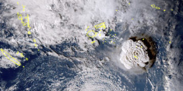 In this satellite image taken by Himawari-8, a Japanese weather satellite, and released by the agency, shows an undersea volcano eruption at the Pacific nation of Tonga Saturday, Jan. 15, 2022. An undersea volcano erupted in spectacular fashion near the Pacific nation of Tonga on Saturday, sending large waves crashing across the shore and people rushing to higher ground. (Japan Meteorology Agency via AP)