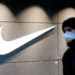 A man wearing a protective face mask amid the outbreak of the coronavirus disease (COVID-19) walks past a Nike brand store in central Kyiv, Ukraine December 10, 2020. REUTERS/Valentyn Ogirenko