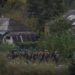 Ukrainian servicemen walk, as Russia's attack on Ukraine continues, in the town of Izium, recently liberated by Ukrainian Armed Forces, in Kharkiv region, Ukraine September 14, 2022. REUTERS/Gleb Garanich