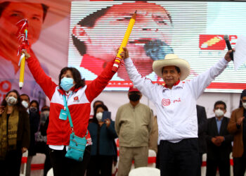 LIMA, PERU - MAY 18: Presidential candidate Pedro Castillo (R) and Vice Presidential candidate Dina Boluarte (L) greet supporters during a campaign event to present his working team ahead of the Presidential runoff at Estadio El Dorado on May 18, 2021 in Puente Piedra, Lima, Peru. (Photo by Raul Sifuentes/Getty Images)